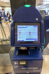 A shared automated check-in kiosk at ORY
