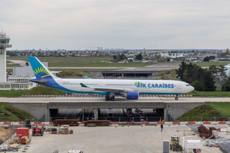 Views from the ORY observation deck encompass a couple of taxiways, an entrance road, and a runway. Air Caraîbes is the sister airline to French Bee