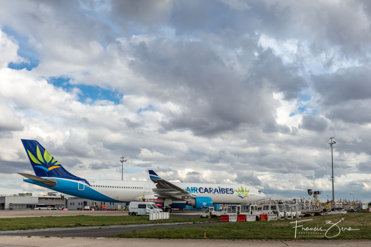 An Air Caraibes A330 at a remote stand at ORY