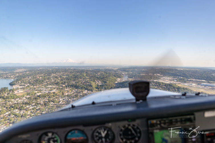 In the traffic pattern at Boeing Field. The view doesn't suck - that's Mount Rainier on the horizon, and the airfield is on the lower-right side of the image