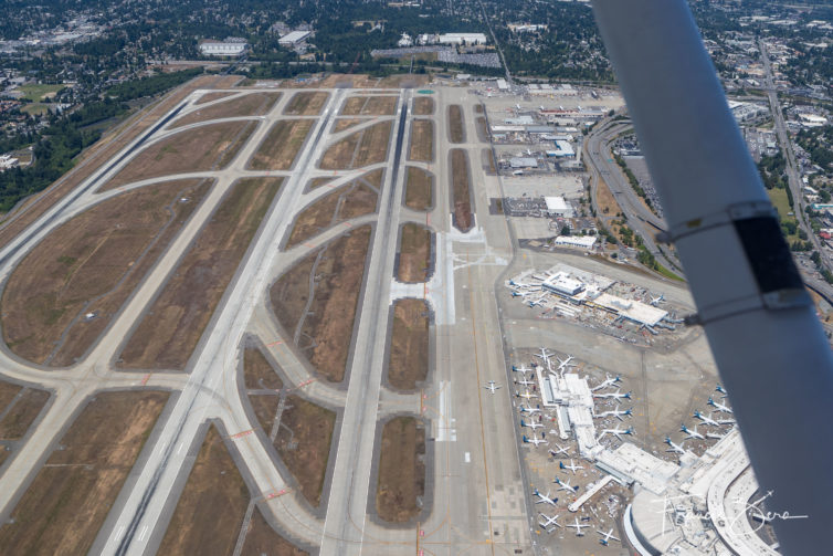 We overflew Sea-Tac Airport (SEA) on a recent flight back from the Olympic Peninsula. Called the Mariner Transition, it requires advance permission and active coordination from air-traffic controllers at SEA.