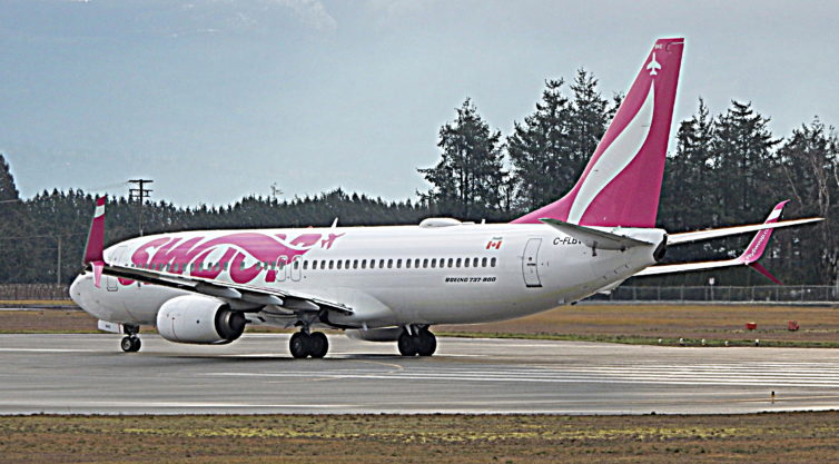 A Swoop 737 taxiing at YXX