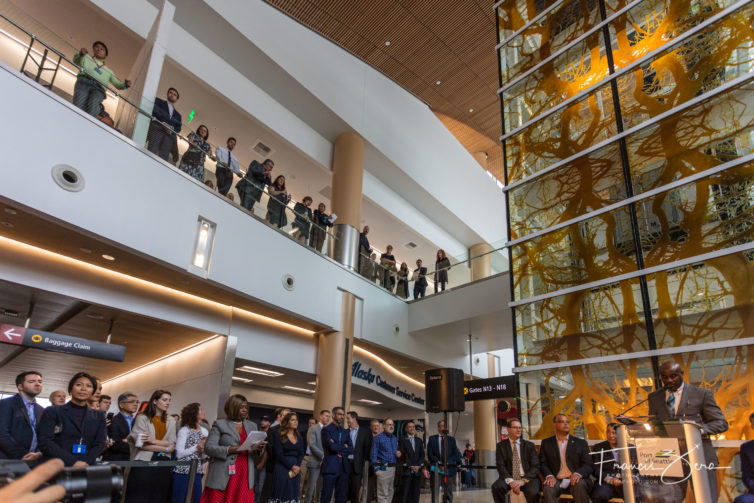 A two-story atrium features several large art pieces