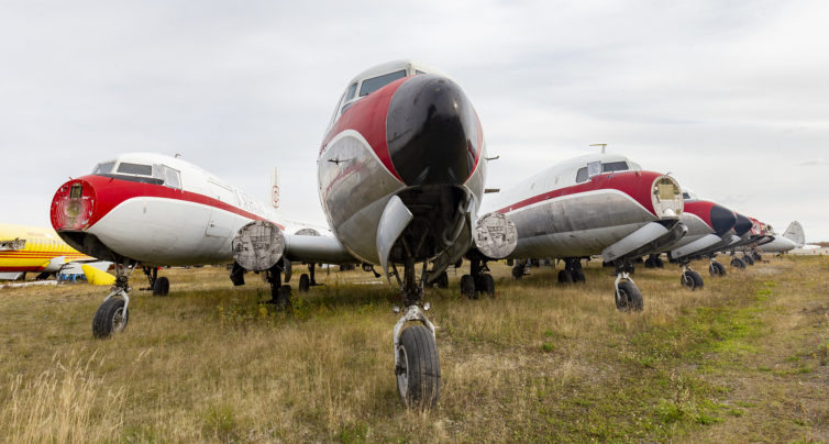 Eight wingless DC-6s, two DC-9F, and a peek of Dumbo's tail.  The DC-9 on the left, N952AX, still wearing its Airborne Express / DHL was a neat find, tucked in behind everything else. The DC-6s, including N4206L, N1036F, N1377K, N1027N, and N3050P, are in the livery of former owner Northern Air Cargo.