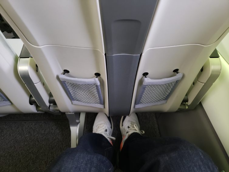 Plenty of legroom in the exit row of the A220. Photo: Jonathan Trent-Carlson