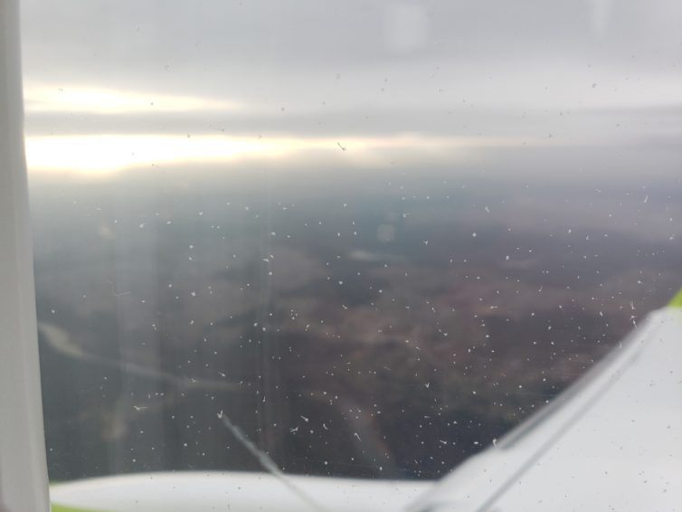 Small ice crystals stick to the window as the sun tries to break through on our approach into VNO. Photo: Jonathan Trent-Carlson