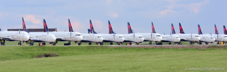 Delta planes line MCI's 1R/19L and taxiway.