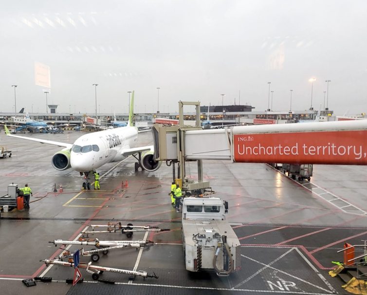 An airBaltic A220 pulls up to the gate at AMS. Photo: Jonathan Trent-Carlson