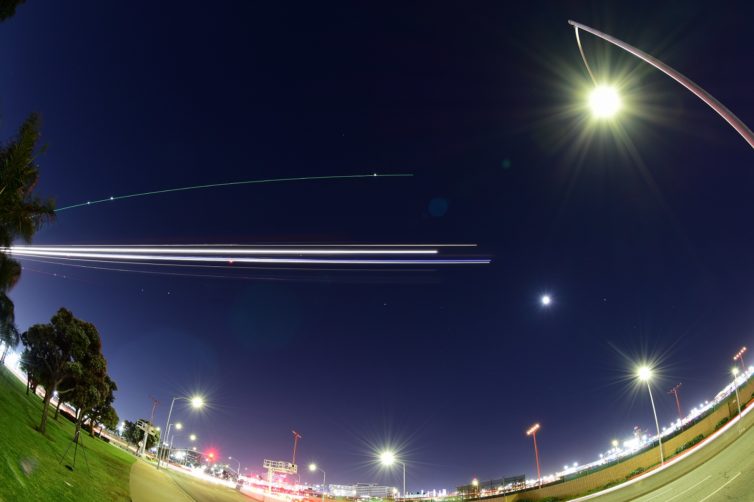 A fisheye long-exposure taken at the threshold of LAX runway 24-R. - Photo: JL Johnson
