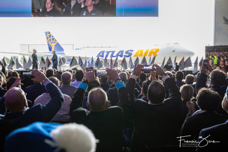 Attendees recorded the opening of the giant hangar doors for the reveal of the jet at the end of the event