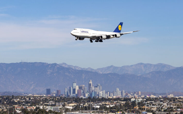 A Lufthansa Boeing 47-800 passes downtown LA on final for LAX