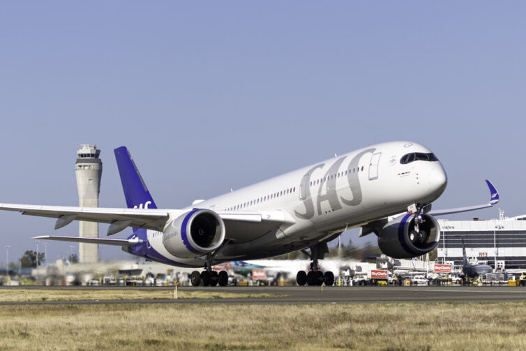 An SAS A350 rotating for takeoff at SEA