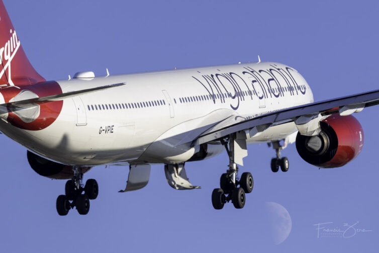 A Virgin Atlantic A330 departs in front of the moon
