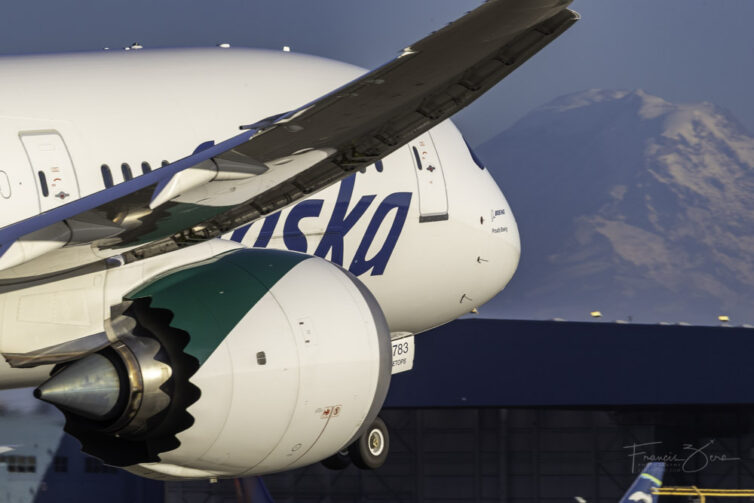 An Alaska Air B787 departs from at SEA with Mount Rainier visible in the distance
